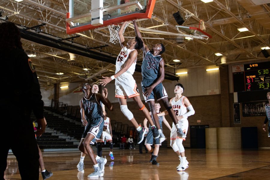 A Texas High player goes up for a dunk to score against Altlanta. The Tigers defeated the Rabbits 79-66 in the first game of the season on November 13th.