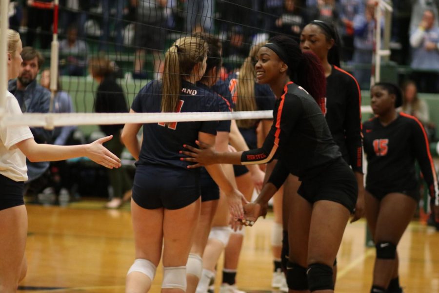 The+Lady+Tigers+wish+the+Wakeland+Wolverines+good+luck+as+they+begin+their+first+set.+Texas+High+lost+the+regional+semifinals+in+three+sets+after+advancing+in+a+historic+season.