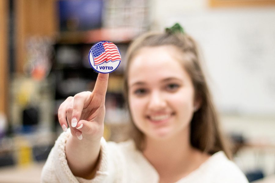Texas High student Senior Paisley Allen poses proudly with her I voted sticker. Midterm elections ended at 7 p.m. on Nov. 6.