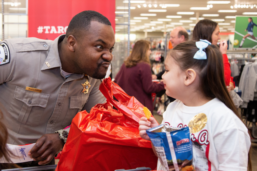 Police+officers+accompany+children+at+Target+as+they+buy+toys.+Shop+with+a+Cop+was+held+at+Target+on+Dec.+4.