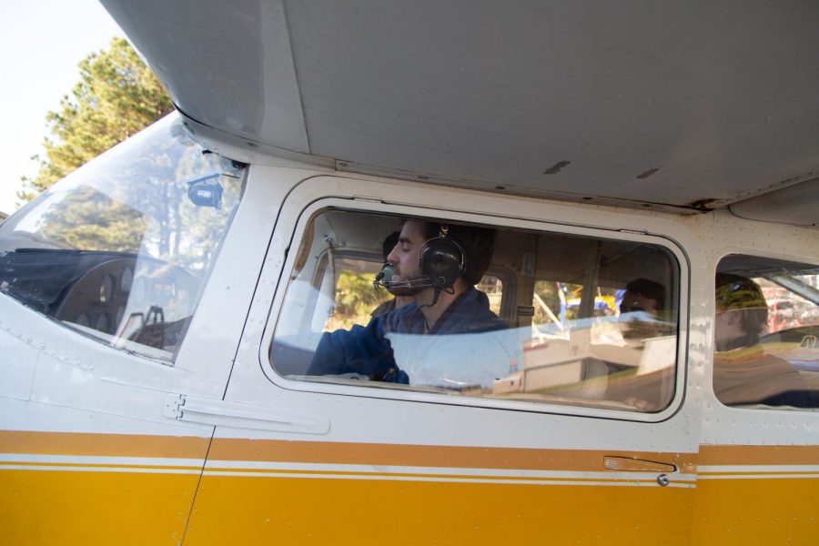 Senior Connor Nations is pursuing his pilots license while taking the aviation mechanics class. Aviation mechanics students examined the inside of a plane in the hangar of SAU Tech. 