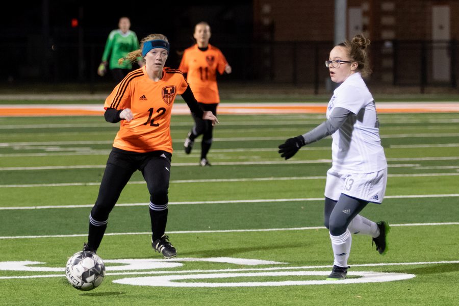 In a game against the Paris Lady Cats, sophomore Janie Rounds moves the ball down field. The Lady Tigers won 4-1.