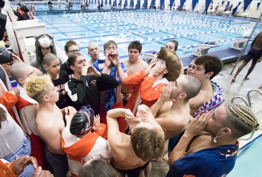 The Tigersharks chant before the first today of the regional meet in Frisco, Texas. 