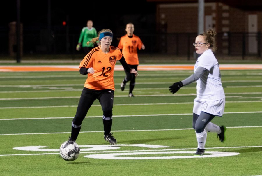 Sophomore Janie Rounds goes after the soccer ball. The girls soccer team played against the Greenville Lions. 