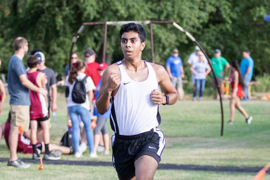 Senior Nabil Kalam runs at the Trinity cross country meet back in the fall. Kalam has been a member of the cross country team for two years. 