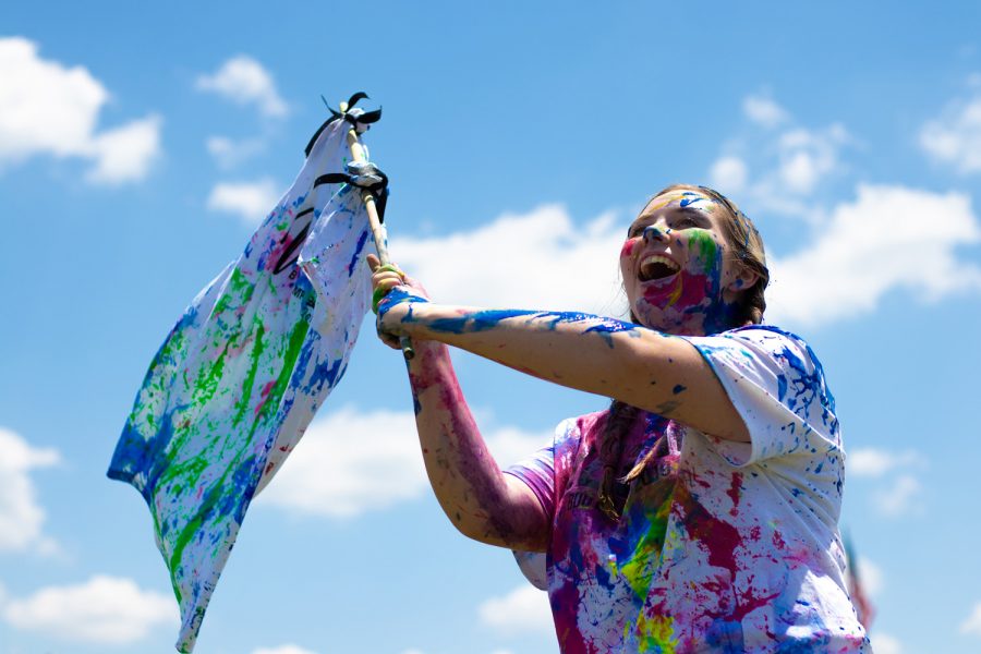 Senior Molly Kyles waves a newspaper t-shirt during the annual Paint War that ended the Publication Bootcamp. She said, “There’s nothing quite like screaming and attacking your staff with paint guns to start off the year! The paint takes forever to wash off but it’s worth it for the amount of fun we all have!”
