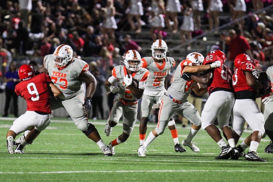 Senior Tracy Cooper runs the ball in the first quarter. Texas High School played against Kilgore High School on September 20, 2019.