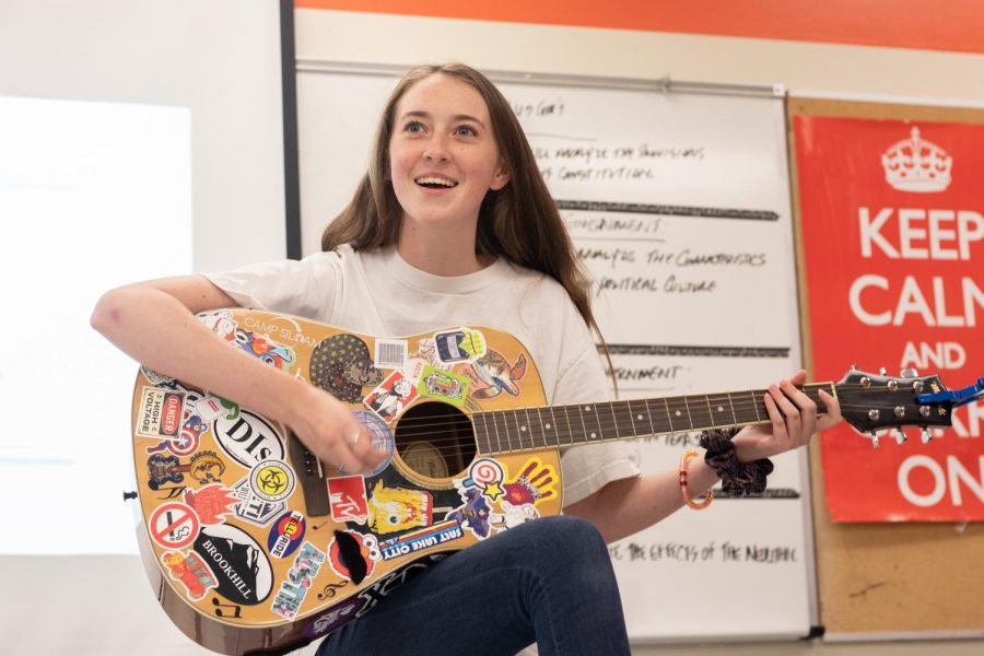 Junior Lia Graham leads the guitar club in a jam session. The club met for the first time Wednesday September 11 after school in Mr. Davis room. 