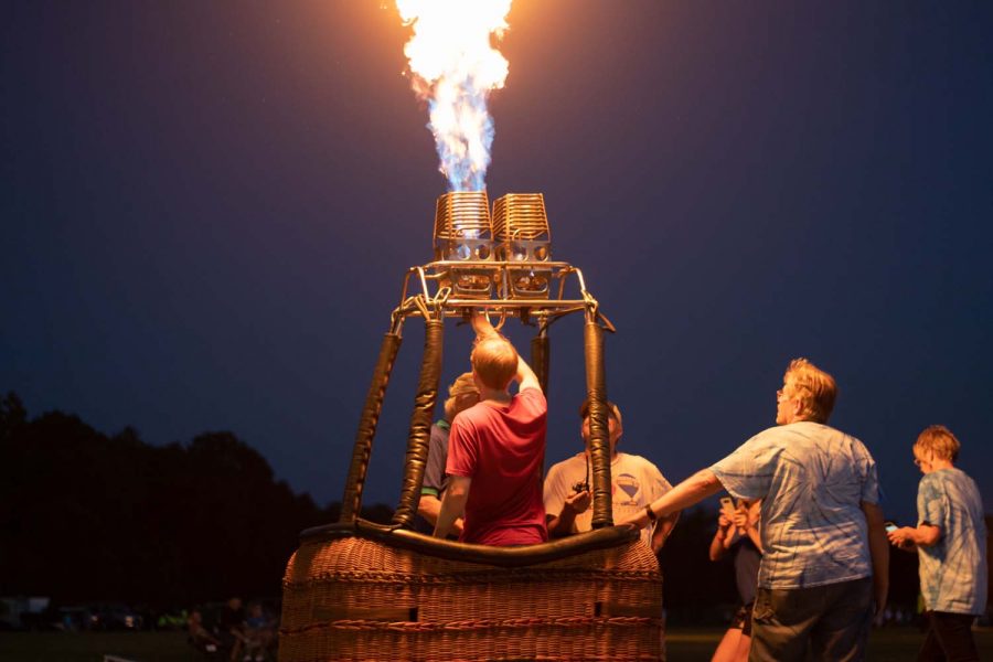 A hot air balloon owner demonstrates how hot air balloons inflate. The annual Hot Air Balloon Festival was held in Plano, Texas on September 21, 2019. 