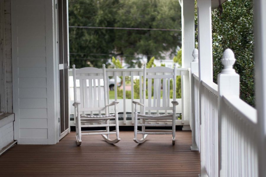 Two rocking chairs sit on the wooden porch of the Excelsior Hotel in Jefferson, Texas. This rumored ghost infested hotel has brought in guest from all across the country.