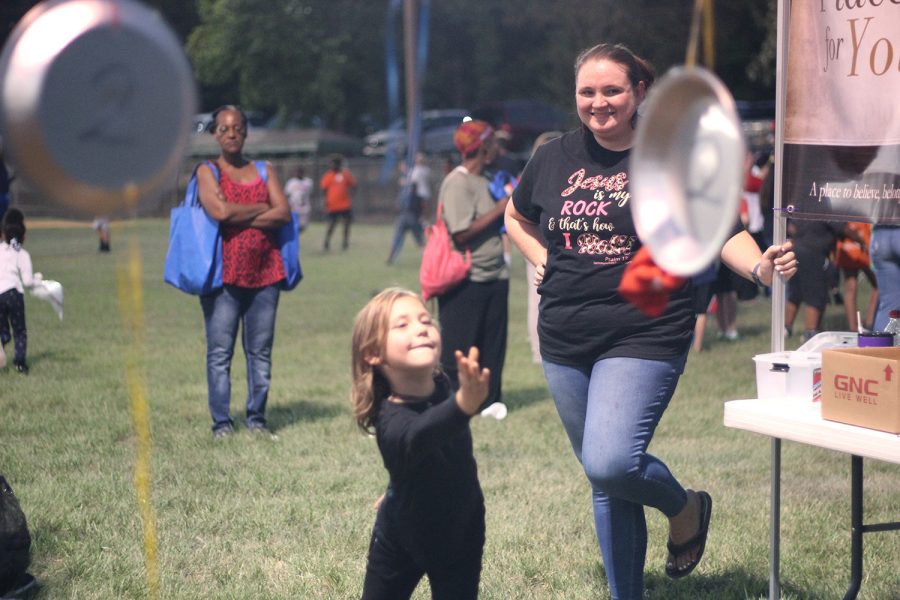 A mother and child participate in the National Night Out festivities at King Park in Wake Village, Texas on Oct. 1, 2019. National Night Out brought neighborhood residents to eat, fellowship and play games in an effort to get to know one another.