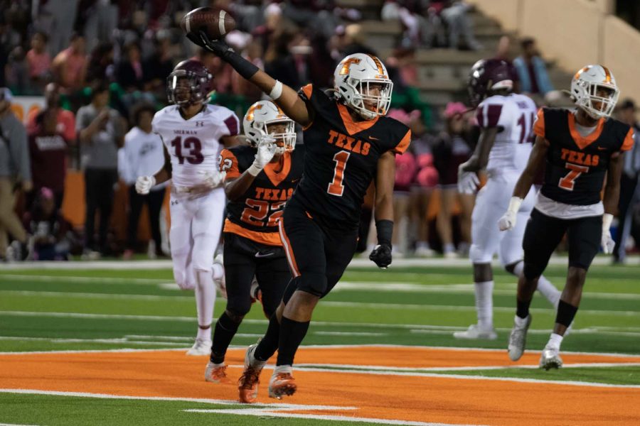 Junior Jaylen Green holds the ball up in celebration after sacking Sherman quarterback Tate Bethel. Texas High snapped a three game losing streak, as they won 27-14