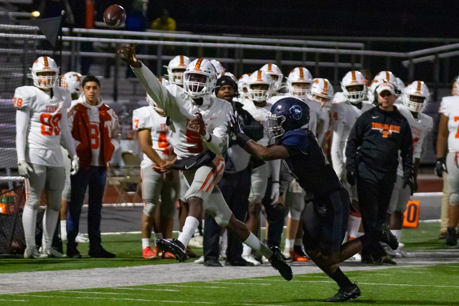 Junior quarterback Rian Cellers avoids a Wylie East defender to complete a pass in the 40-13 win. The victory kept the post season hopes alive for the Tigers.