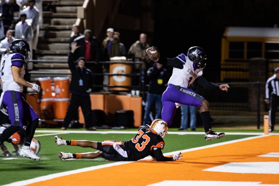 Sophomore defensive back Jalen Jones attempts to tackle Frisco Independence quarterback Braylon Braxton as he scores a touchdown in the second quarter of the 5A D1 Area playoff game on Nov. 22 at Tiger Stadium. The Tigers met an end to their football season in the second round of the playoffs with a 45-30 loss. 