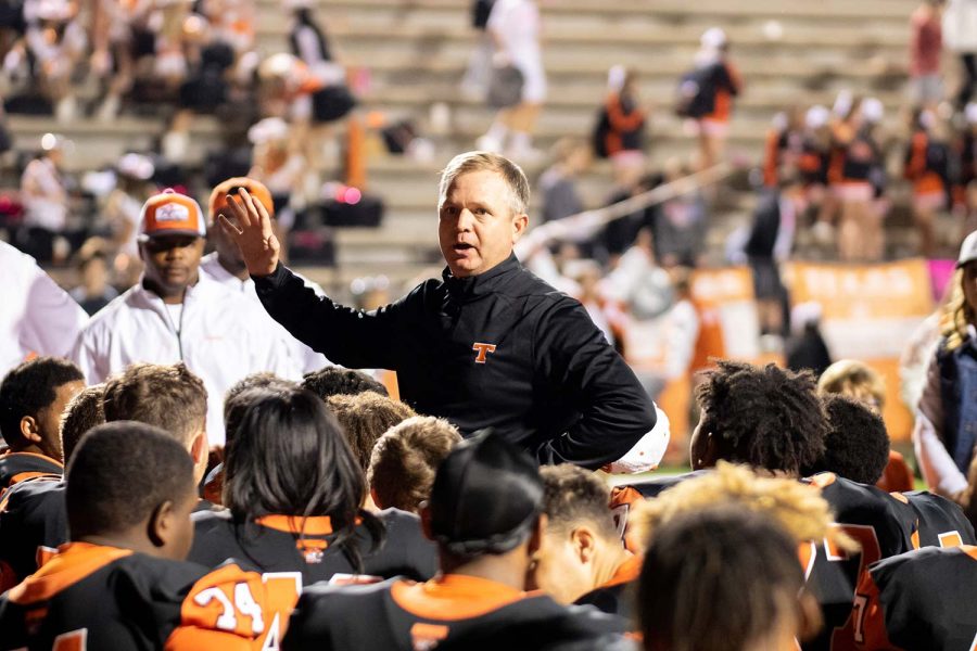 Texas High athletic director and head football coach Gerry Stanford speaks to players after a game. The Texas High Tigers advanced to playoffs after a game against West Mesquite. 