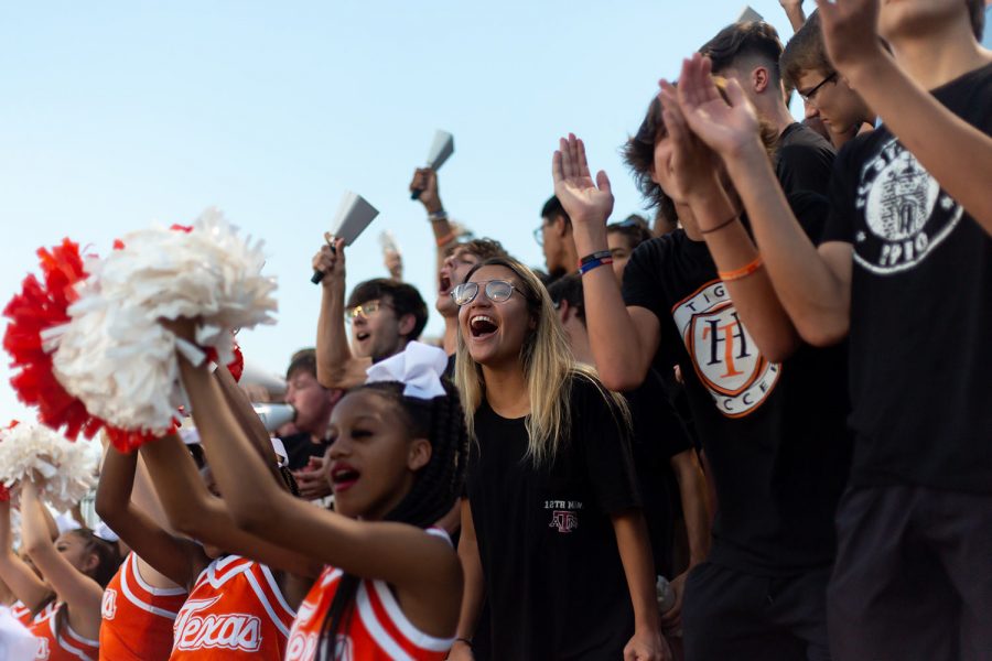 Senior Mya Bowers cheers for the Texas High Tigers as they play against Liberty Eylau. This was the first home game of the season for Texas High.