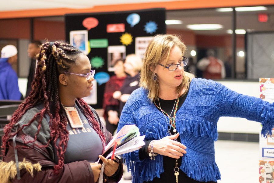Human growth and development teacher Maurice Oldham speaks with a prospective student at the 2019 8th Grade Orientation. Students and parents tour the Texas High facilities and speak with teachers to help incoming freshman decide which classes to take at THS.