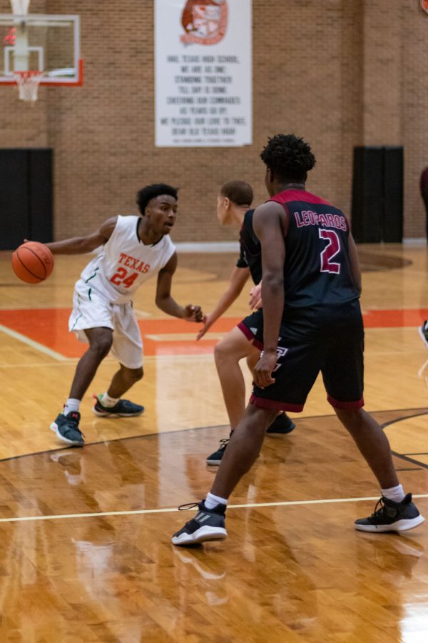 Texas High school Junior Varsity player protects the ball From Liberty Eylau players. The Liberty Eylau game took place January 7th at the Texas High Tiger center.