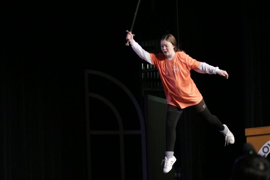 Junior+Cate+Rounds+flies+through+the+air+as+Peter+Pan+during+dress+rehearsal.+This+is+the+first+time+that+Tiger+Theater+has+had+the+opportunity+to+use+a+flying+harness+in+a+show.