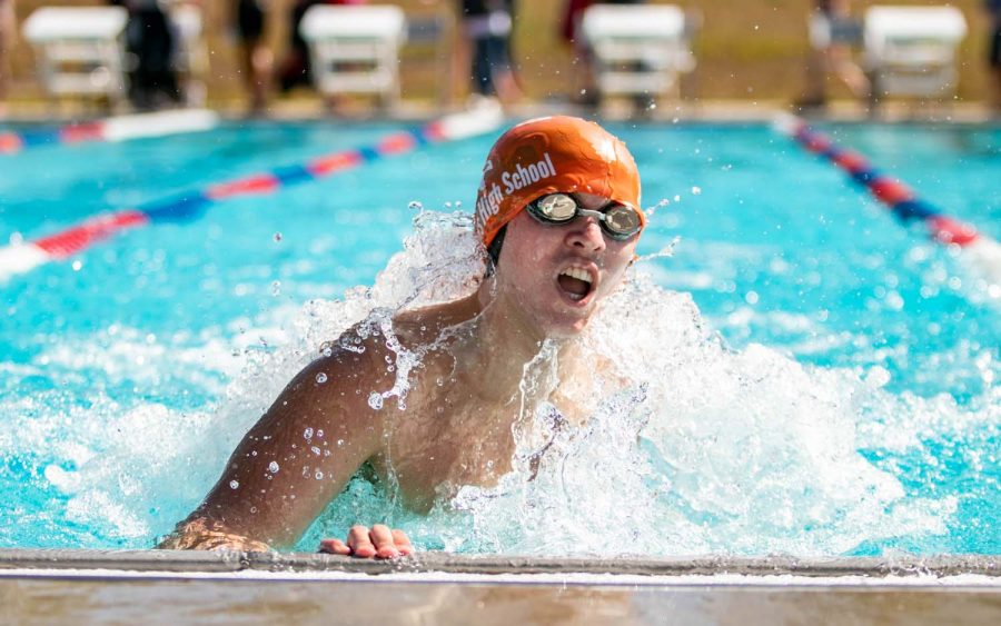 Senior Joshua Oldham turns during his 200 IM at the Tyler Quad Meet. This is the only outdoor meet of the season, and give swimmers an extra time to qualify for Frisco Tisca times.
