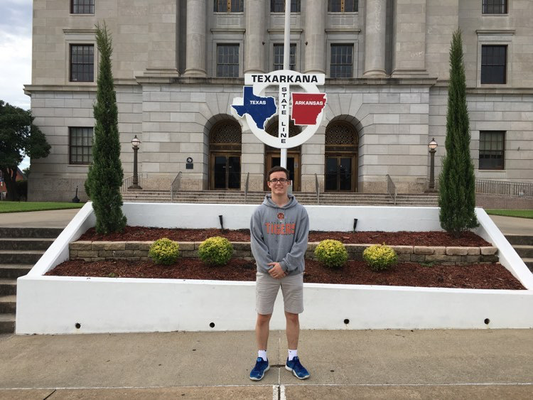 German foreign exchange student Nils Schweizer poses in front of Texarkanas iconic state line. Schweizer was forced to return to Germany two months early due to concerns about COVID-19.