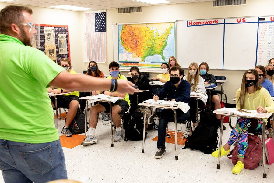 History teacher Danny Williams leads his class in discussion. Every student on campus is required to be masked. 