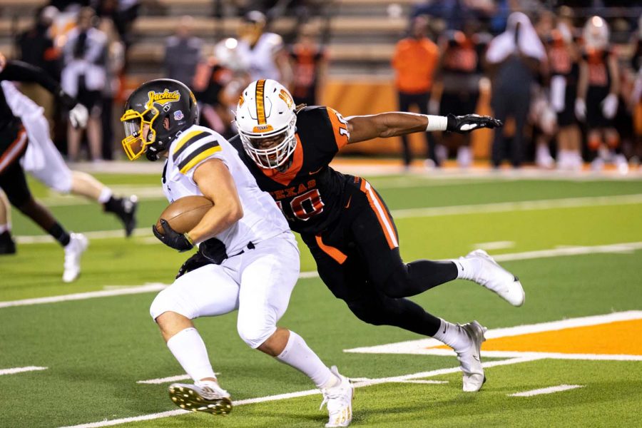 Texas Highs Clayton Smith pursues Denisons Asa Osborn in the second quarter of the home opener on Oct. 2, 2020. The Tigers defeated the Yellow Jackets 24-3 improving their record to 2-0.