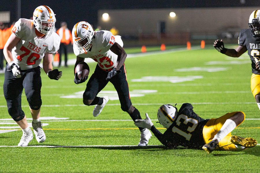 Daquarrieon Witcher powers through an attempted tackle by the opposing team. The Tigers cut it close with a four-point win, the final score being 21-17.