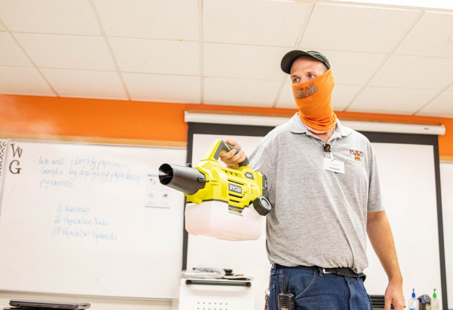 Custodian David Ames fogs a room that a symptomatic student has previously been in. When someone tests positive for COVID-19 or leaves campus due to an unidentified illness, the rooms that student attended are sanitized with disinfect. 