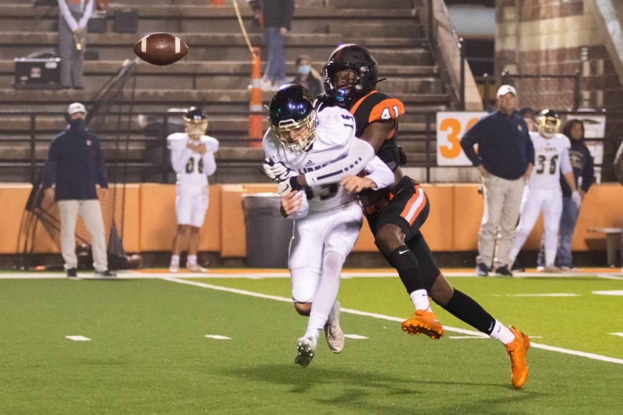 Junior Derrick Brown causes a fumble in the first quarter in the game against Lake Creek in the first round of the 2020 playoff season. The Tigers did not capitalize on the fumble recovery. 