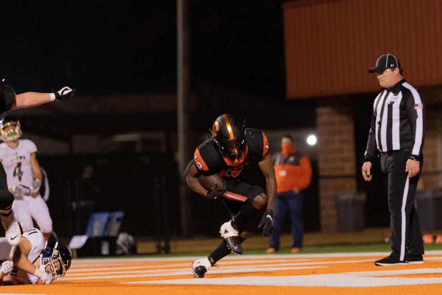 Senior Daquarreon Collier-Witcher stuts in the end zone. Witcher played as the starting running back.