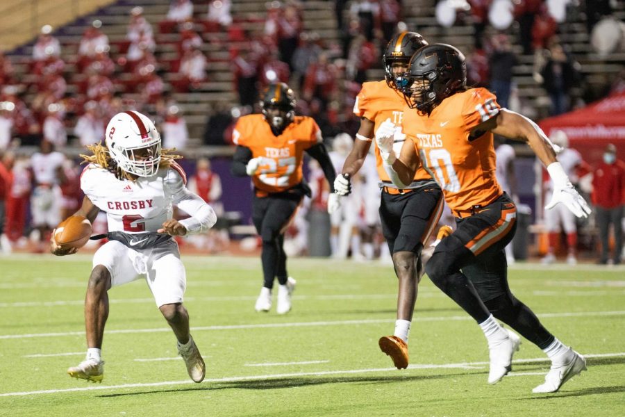 Crosby runningback Reggie Branch attempts to evade Texas Highs Clayton Smith and Derrick Brown last Friday night during the second round of the 2020 playoffs. The Tigers battled the Cougars at Lumberjack Stadium on the campus of Stephen F. Austin University in Nacogodches, Texas.