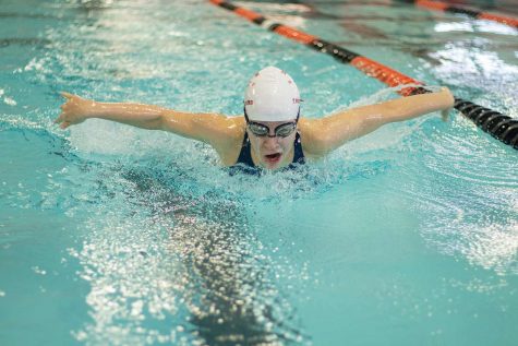 Sophomore Teagan Jones spreads her arms in the butterfly event while racing swimmers from El Dorado and Magnolia on Saturday Dec. 4, 2020. The Tigersharks hosted only two teams because of COVID-19 social distancing rules imposed by the University Interscholastic League.