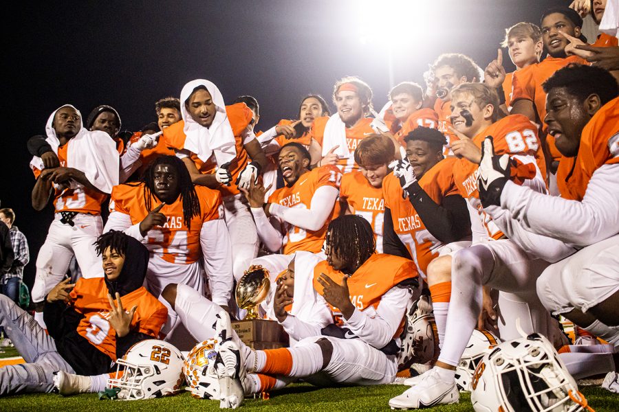 The football players huddle together with their adrenaline still high after yet another win. The Tigers finished their 2020 season as District Champs.