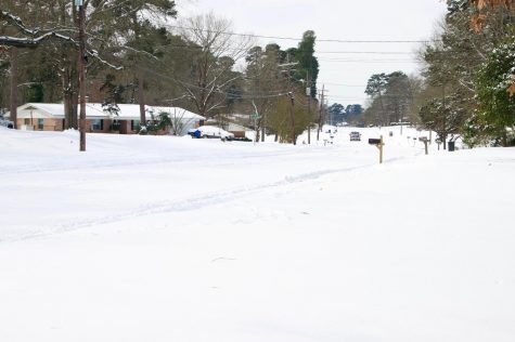 Snow covers Old Redwater Rd. in Wake Village on Feb. 15. The winter storm forced multiple roadways to shutdown. 