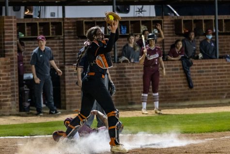 Sophomore Emma Prince catches the ball at home in an attempt to get Liberty Eylau player out. The Lady Tigers beat rival school, Liberty Eylau 9-7.