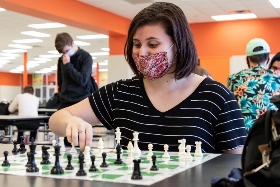 Senior Katarina Jordan places a round of chess during her enrichment. Jordan is the only girl competitor in class. 