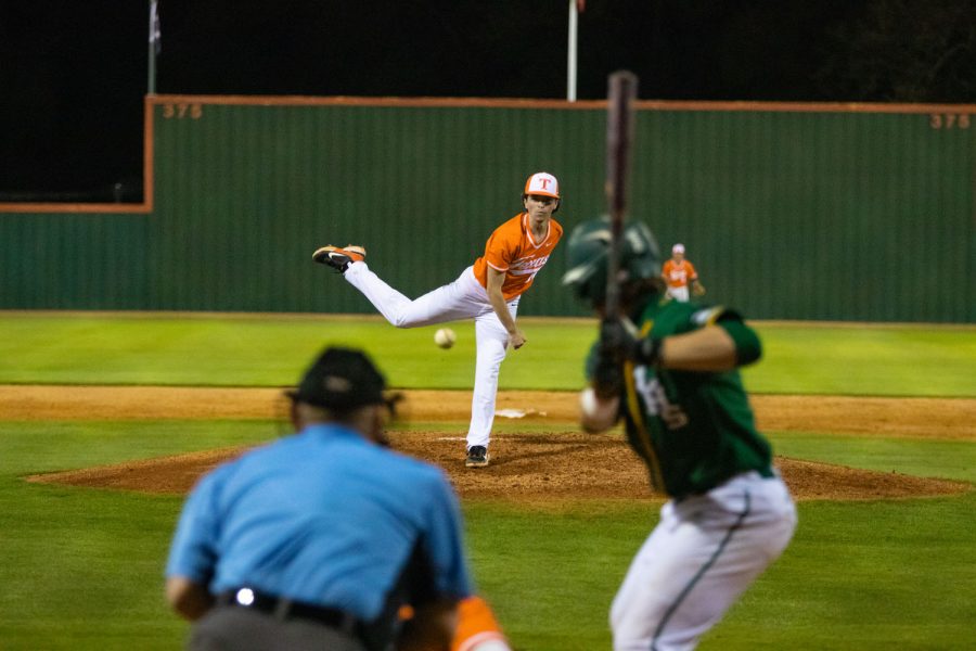 Pitcher Luke Smith launches a pitch during the home game against the Longview Lobos. The Tigers lost the game with a score of 4-2.
