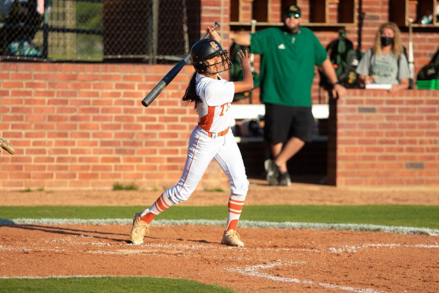 Junior Lauren Allred swings for a ball in the Lady Tigers home game against the Longview Lobos. The Tigers ended the game with a win of 9-3.