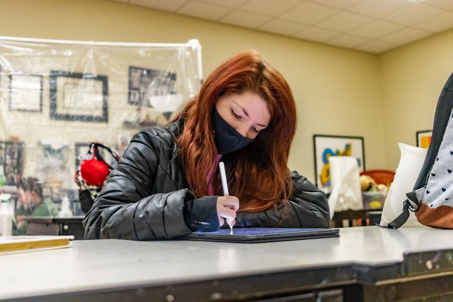 Amelia Stansbury works on one of her latest digital art pieces in class. After high school, Stansbury plans to teach art.