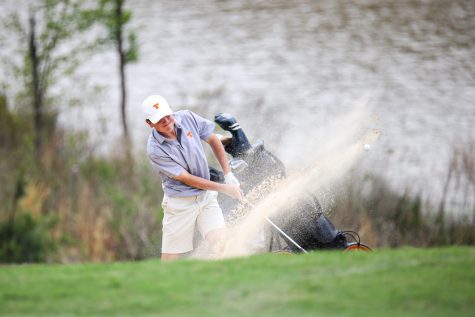 Thomas Curry hit the ball out of the bunker on hole 16 of their District meet. The meet was held at Tempest Golf Club on Tuesday, March 27.
