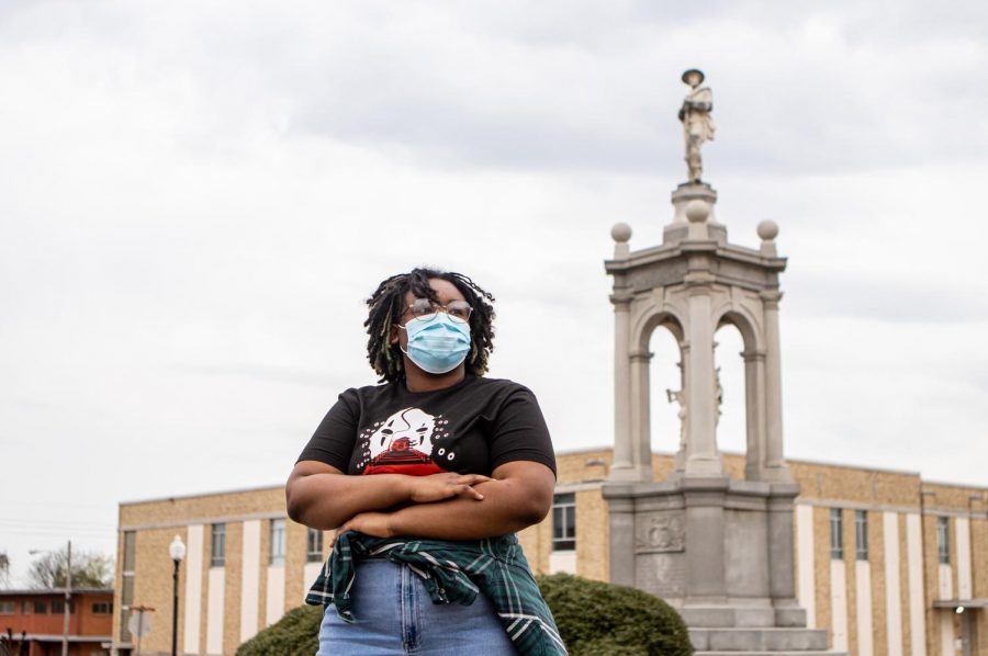 Junior Margaret Mutoke stands in front of the confederate statue that stands in downtown Texarkana. Crowds of people gathered at the statue in June of 2020 to protest its removal. 