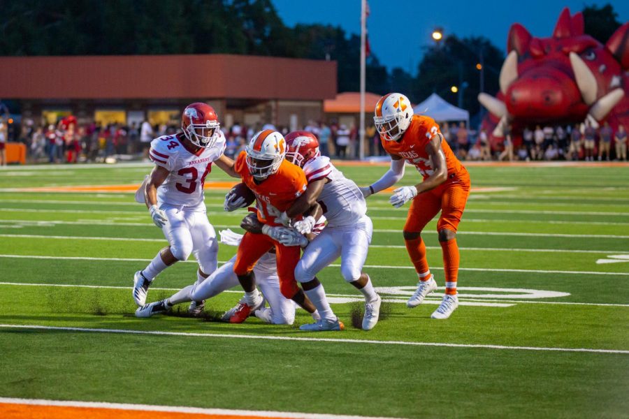 During the 2018 Texas v. Arkansas game Texas High Varsity football players attempt to break out of an opposing teammates grasp to make it into the end zone. The Texas High Tigers played the Arkansas Razorbacks on September 8, 2018.