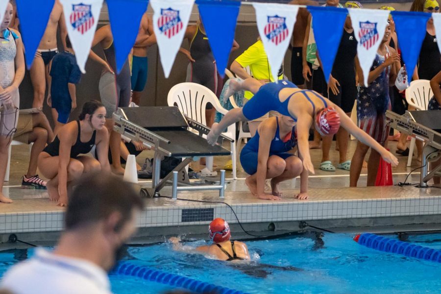 Senior Allyson Smith dives into the water during the 2021 Junior Olympics. Houston, Texas hosted the Junior Olympics July 28 through August 6.