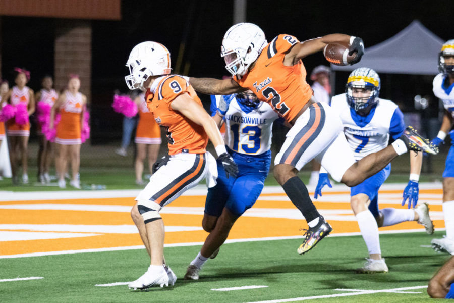 Senior running back Braylon Stewart rushes for a touch down against the Jacksonville on Oct. 22, 2021. Texas High improved their 2021 season record 7-0 and clinched a playoff berth with the 42-9 victory against the Indians.