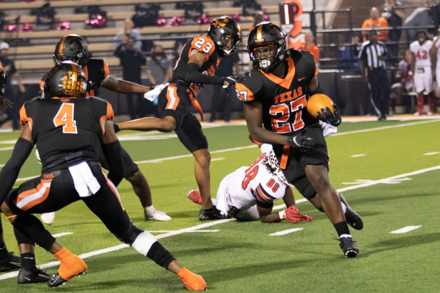 Texas Highs Javarous Tyson returns an intercepted lateral from the Marshall Mavericks quarterback in the Tigers 27-12 victory at Tiger Stadium on Oct. 9, 2021. The Tigers improved their season record to 4 - 0 overall and 1 - 0 in district play.