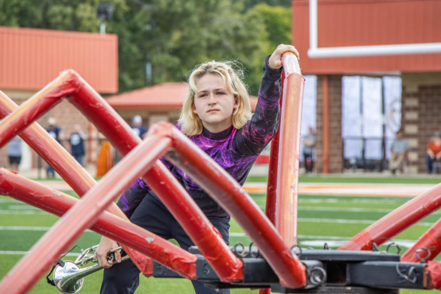 Senior Park Johnson prepares for his solo atop the spider props designed for the program The Web.