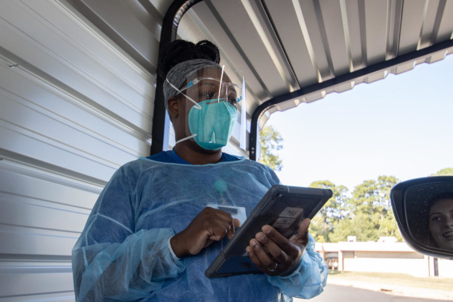 Lachell Baselle works at the TISD COVID testing site on Waterall Street. The testing site is available to students and faculty experiencing COVID symptoms.