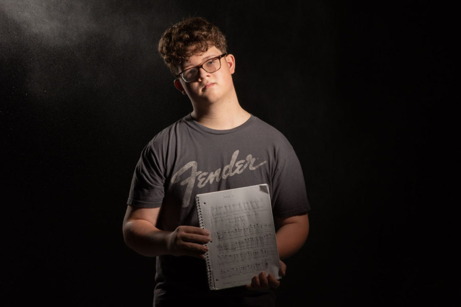 Sophomore Pierce McDonald writes the rough draft of his musical in a journal to keep his work all in one spot.