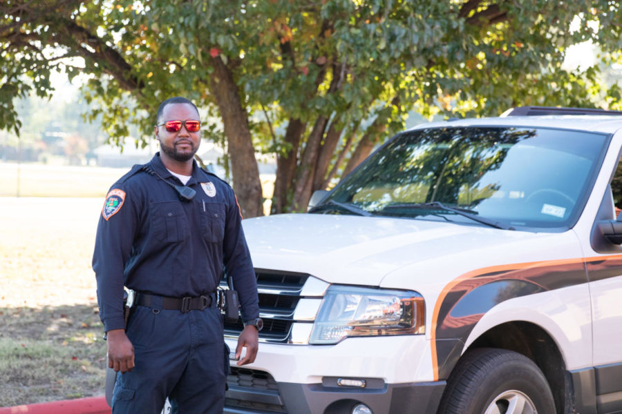 TISD police officer Jonathan Matlock dons his uniform while on duty. Matlock is a Texas High alumnus and former member of the Texarkana Texas Police Department.